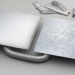 Aluminized steel sheet and galvanized steel sheet compared side by side with an exhaust pipe